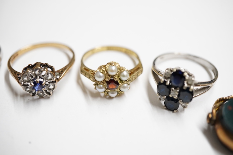 A small group of jewellery to include, four modern 9ct gold and gem set rings including garnet and seed pearl cluster and sapphire and diamond cluster, one other modern 9k and gem set ring, five assorted 9ct and gem set